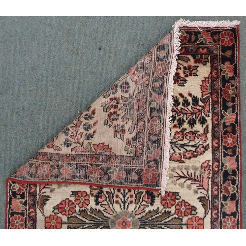 2139 - A CREAM GROUND HAMADAN RUNNERwith seven floral medallions and dark blue floral border, 459cm long x ... 