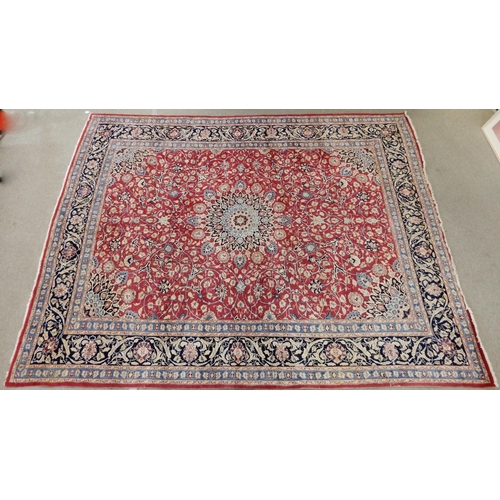 2141 - A RED GROUND KESHAN RUGwith blue central medallion, matching spandrels and dark blue border, 373cm l... 