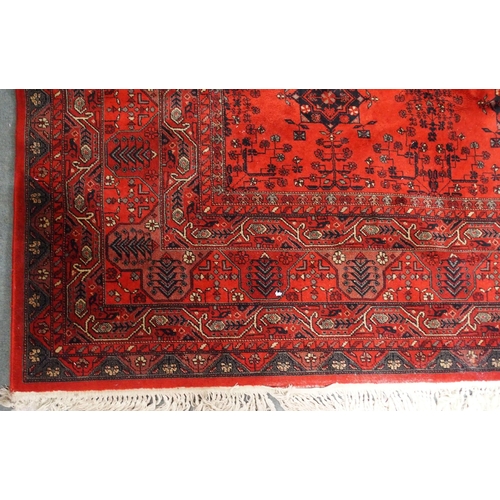 2144 - A DARK RED GROUND AXMINSTER STYLE RUGwith all-over design, multicoloured geometric borders, 366cm lo... 