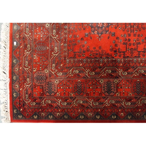 2144 - A DARK RED GROUND AXMINSTER STYLE RUGwith all-over design, multicoloured geometric borders, 366cm lo... 