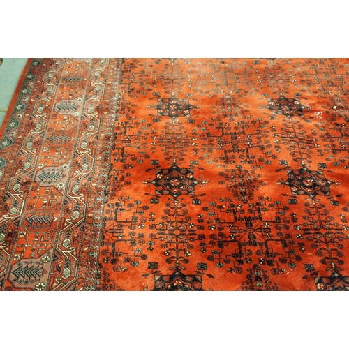 2144 - A DARK RED GROUND AXMINSTER STYLE RUGwith all-over design, multicoloured geometric borders, 366cm lo... 