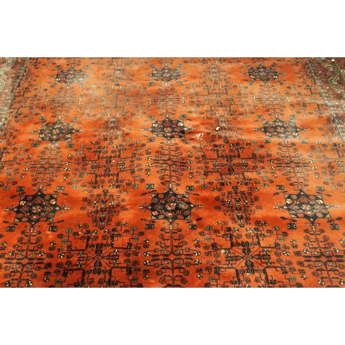 2144 - A DARK RED GROUND AXMINSTER STYLE RUGwith all-over design, multicoloured geometric borders, 366cm lo... 