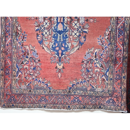 2146 - A LIGHT RED GROUND MAHAL RUGwith floral multicoloured central medallion, matching spandrels and flow... 