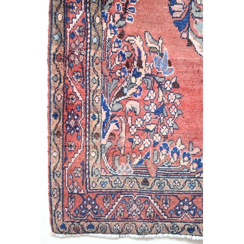 2146 - A LIGHT RED GROUND MAHAL RUGwith floral multicoloured central medallion, matching spandrels and flow... 