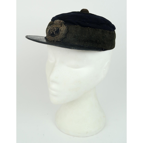 2653 - A VICTORIAN GENERAL SERVICE KEPI/FORAGE CAPWith patent leather peak, cord central boss, broad lace b... 