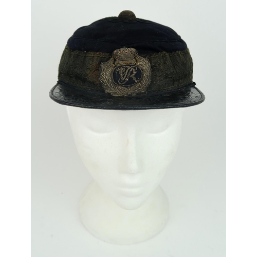 2653 - A VICTORIAN GENERAL SERVICE KEPI/FORAGE CAPWith patent leather peak, cord central boss, broad lace b... 