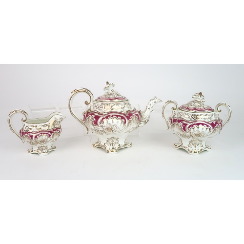 2152 - A ROCKINGHAM STYLE TEASETof moulded rococo design, the white ground with gilt vine and grape decorat... 