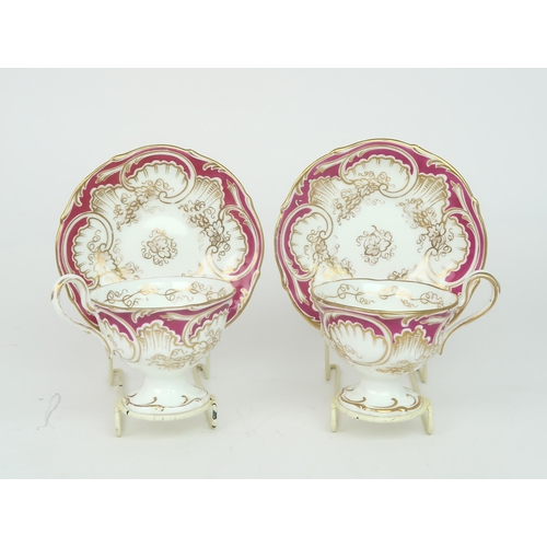 2152 - A ROCKINGHAM STYLE TEASETof moulded rococo design, the white ground with gilt vine and grape decorat... 