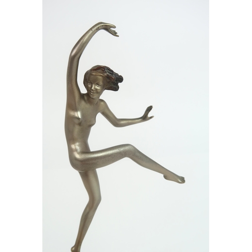 2153 - IN THE STYLE OF JOSEF LORENZL a silvered Art Deco figure of a girl balancing on one foot w... 