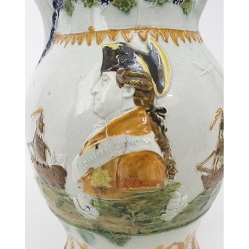 2167A - A COMMEMORATIVE PRATT WARE JUGcirca 1797, moulded to one side with a profile portrait Admiral D... 