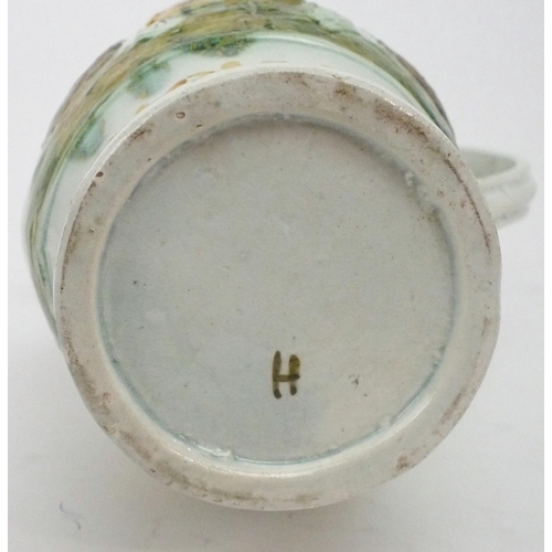 2167A - A COMMEMORATIVE PRATT WARE JUGcirca 1797, moulded to one side with a profile portrait Admiral D... 