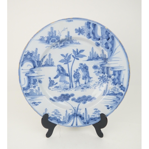 2170 - AN 18TH CENTURY DELFT CHARGERpossibly north German Hanau, painted in blue and white with figure... 