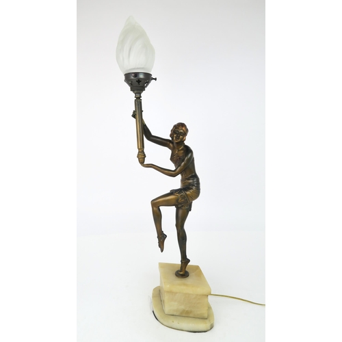 2177 - AN ART DECO LADY LAMPmodelled standing on tip toes, with one knee and both arms raised, the arms sup... 