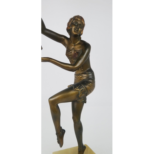 2177 - AN ART DECO LADY LAMPmodelled standing on tip toes, with one knee and both arms raised, the arms sup... 