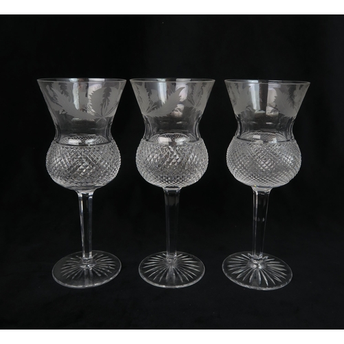 2183 - A SET OF SIX EDINBURGH CRYSTAL THISTLE SHAPED WINE GLASSES 20.5cm high, together with a pair of... 