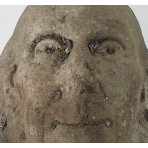 2184 - A CARVED COMPOSITE STONE HEAD OF A MAN28cm high