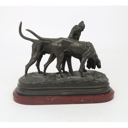 2185 - AFTER ALFRED DUBUCAND A sculpture of two hunting dogs, signed A Dububand, 31cm long... 