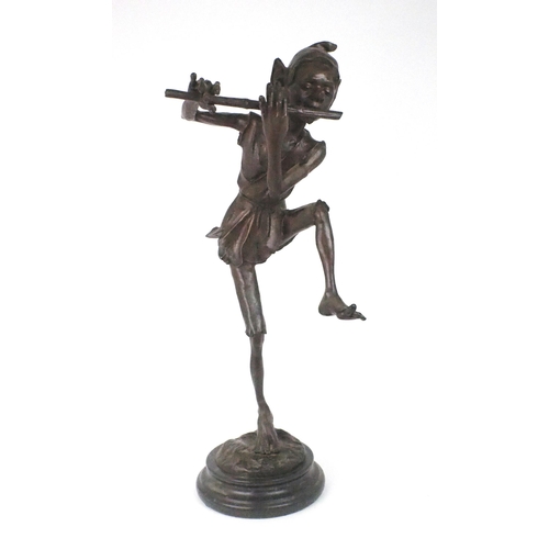 2193 - A LARGE BRONZE OF A PIXIEmodelled standing on one leg playing a pipe, upon circular marble base, 79c... 