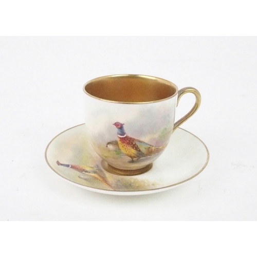 2197 - A ROYAL WORCESTER DEMITASSE CUP AND SAUCEReach painted with pheasants and signed Maybury, date mark ... 