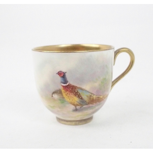 2197 - A ROYAL WORCESTER DEMITASSE CUP AND SAUCEReach painted with pheasants and signed Maybury, date mark ... 