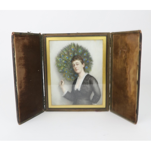 2206 - A 19TH CENTURY PORTRAIT MINIATURE OF A LADYmodelled standing and holding a peacock feather fan, pain... 