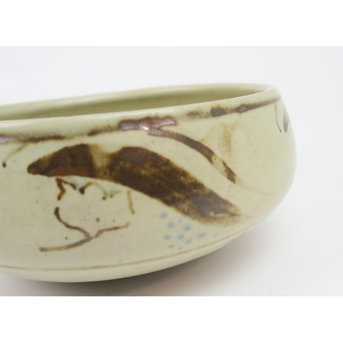 2209 - BERNARD LEACH (1887-1979)A stoneware pottery bowl, painted with scrolling decoration in brown, with ... 