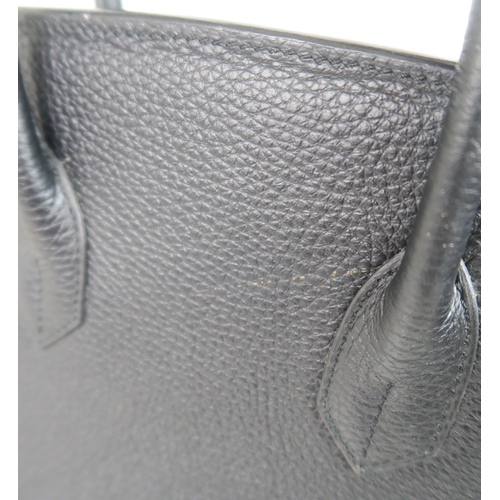 2212 - A HERMES 2010 BLACK BIRKIN 35 HANDBAGthe pebbled leather exterior with dual rolled handles, top flap... 