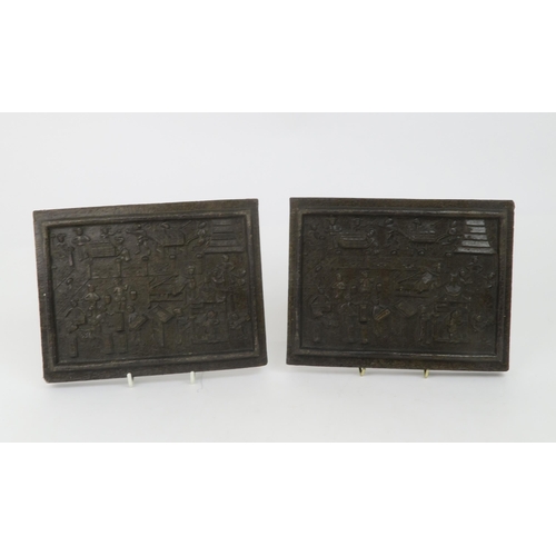 2357 - TWO CHINESE MOULDED TEA BLOCKSDecorated with figures processing tea, 18cm high, 23cm wide and 2.5cm ... 