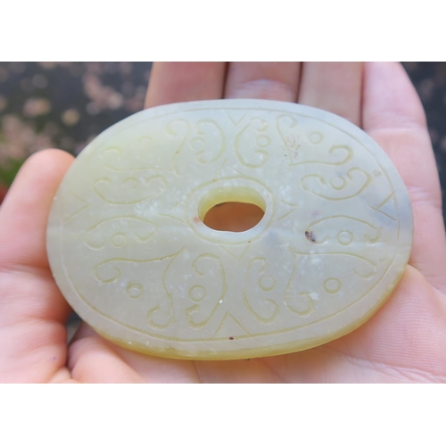 2361 - A CHINESE JADE BUTTON HOOKCarved with a chilong, 9.5cm long and three modern hardstone carved discs,... 