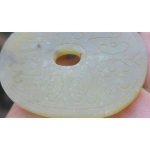 2361 - A CHINESE JADE BUTTON HOOKCarved with a chilong, 9.5cm long and three modern hardstone carved discs,... 