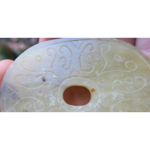 2361 - A CHINESE JADE BUTTON HOOKCarved with a chilong, 9.5cm long and three modern hardstone carved discs,... 