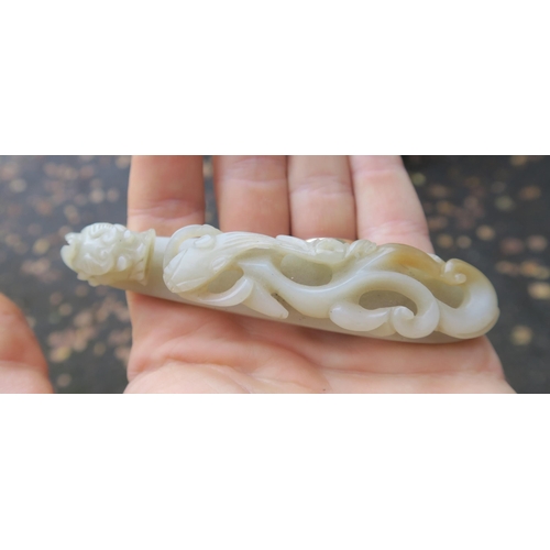 2361 - A CHINESE JADE BUTTON HOOKCarved with a chilong, 9.5cm long and three modern hardstone carved discs,... 