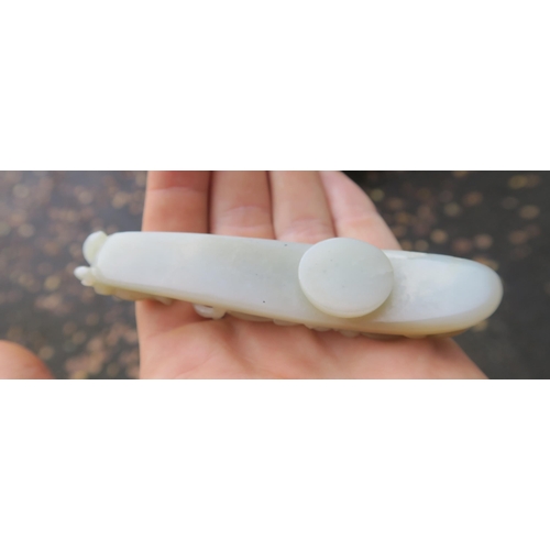 2361 - A CHINESE JADE BUTTON HOOKCarved with a chilong, 9.5cm long and three modern hardstone carved discs,... 