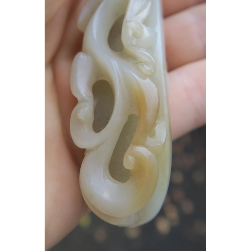 2361 - A CHINESE JADE BUTTON HOOKCarved with a chilong, 9.5cm long and three modern hardstone carved discs,... 