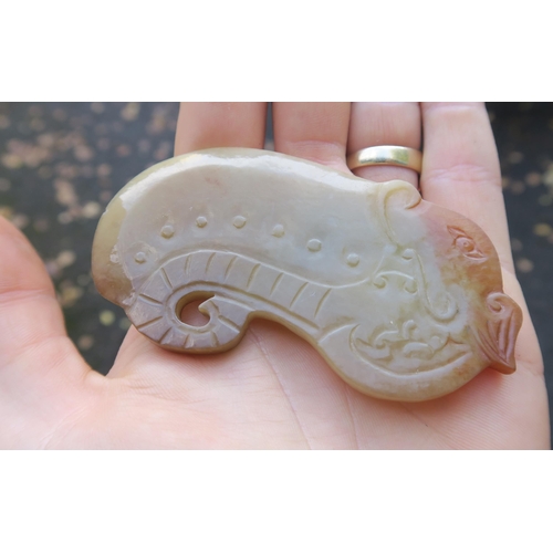 2361 - A CHINESE JADE BUTTON HOOKCarved with a chilong, 9.5cm long and three modern hardstone carved discs,... 