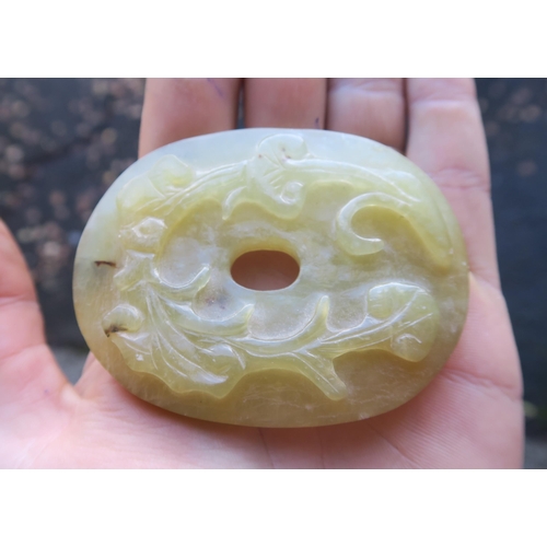 2361 - A CHINESE JADE BUTTON HOOKCarved with a chilong, 9.5cm long and three modern hardstone carved discs,... 