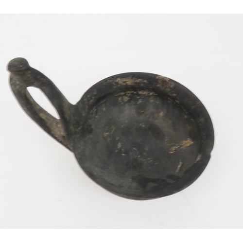 2364A - AN ESTRUSCAN BUCCHERO KYATHOSof plain, slightly swollen form with a single looped handle, set on a s... 