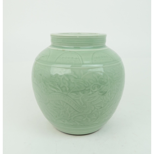 2371 - A CHINESE CELADON VASE Carved with an archaic band above scrolling foliage, and horizontal banding, ... 