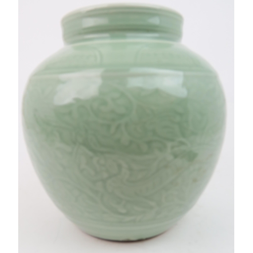 2371 - A CHINESE CELADON VASE Carved with an archaic band above scrolling foliage, and horizontal banding, ... 