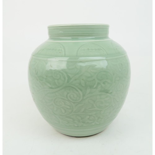 2371 - A CHINESE CELADON VASE Carved with an archaic band above scrolling foliage, and horizontal banding, ... 