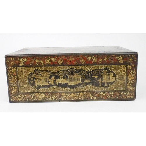 2382 - A CANTON BLACK AND GOLD LAQUERED WRITING SLOPE Decorated with various panels, fitted with velvet ski... 