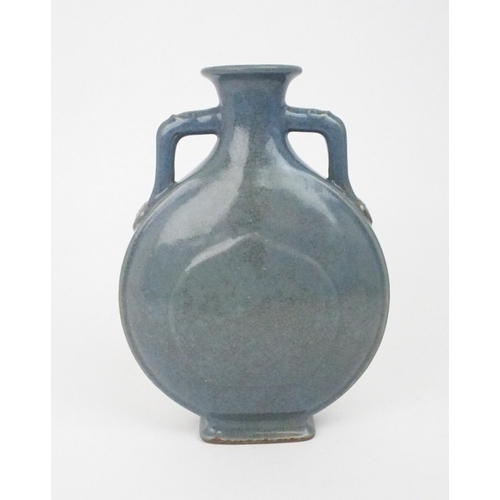 2391 - A CHINESE BLUE GLAZED CRACKLEWARE FLASK With moulded ruji set handles, printed seal mark, 25cm highw... 