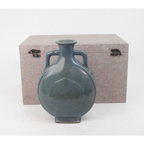 2391 - A CHINESE BLUE GLAZED CRACKLEWARE FLASK With moulded ruji set handles, printed seal mark, 25cm highw... 