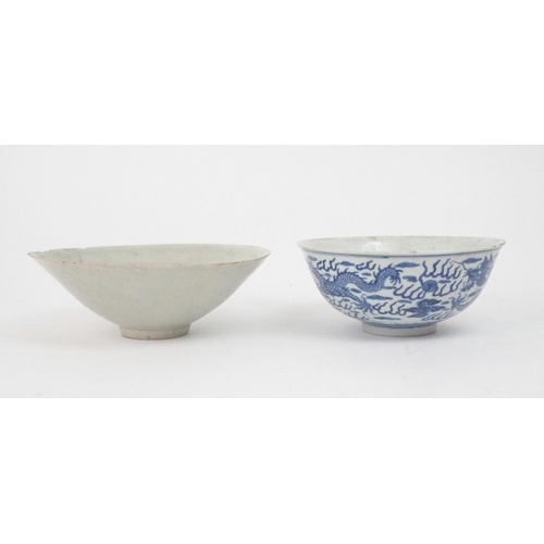 2392 - A CHINESE CELADON GLAZED BOWL Carved with foliage, 19.5cm diameter and a blue and white dragon bowl,... 