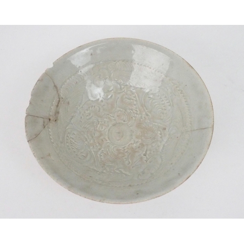 2392 - A CHINESE CELADON GLAZED BOWL Carved with foliage, 19.5cm diameter and a blue and white dragon bowl,... 