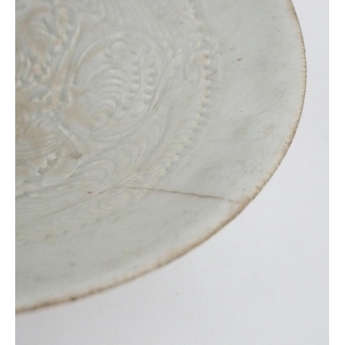 2392 - A CHINESE CELADON GLAZED BOWL Carved with foliage, 19.5cm diameter and a blue and white dragon bowl,... 