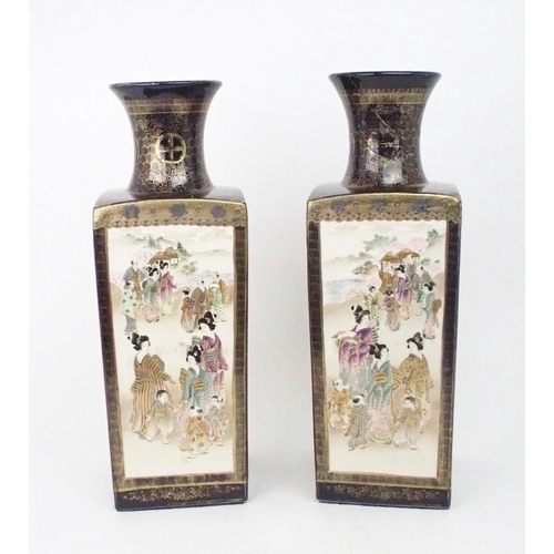 2394 - A PAIR OF SATSUMA SQUARE VASES Painted with panels of figures, landscapes and birds, divided by blue... 