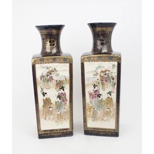 2394 - A PAIR OF SATSUMA SQUARE VASES Painted with panels of figures, landscapes and birds, divided by blue... 