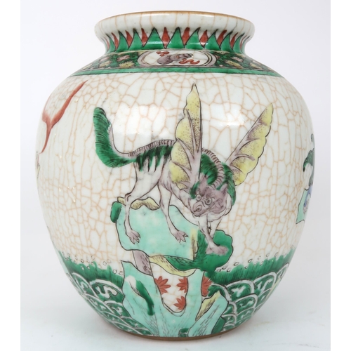 2400 -  A CHINESE FAMILLE VERTE JAR Painted with winged shishi on a crackled ground and bene... 