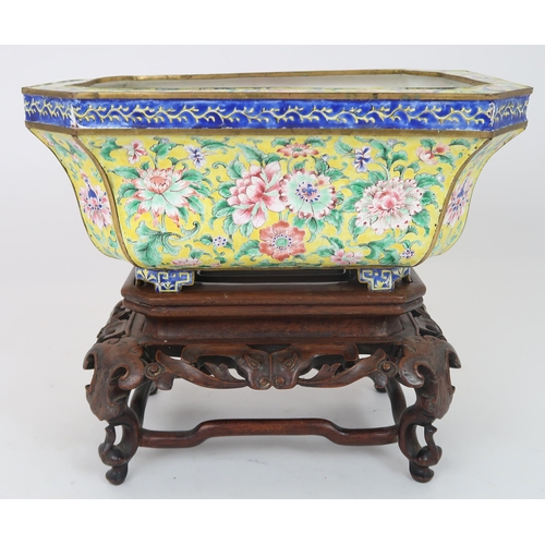 2401 - A CANTON ENAMEL YELLOW GROUND JARDINIERE Painted with peonies and scrolling foliage, beneath a blue ... 